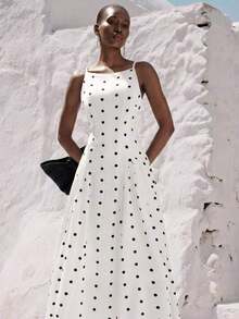 Tela con estampado de lunares, vestido maxi con falda acampanada de diseño elegante, sin mangas, vestido de tirantes finos con base blanca y lunares negros, escote cuadrado, tirantes delgados, corpiño ajustado, falda fluida y relajada, de longitud media, tela de gasa ligera, estilo retro de lunares, ropa casual de verano, adecuado para salidas diarias o vacaciones, estilizador y alargador, vibra elegante minimalista, material cómodo, ideal para vacaciones y salidas - Blanco y Negro - Ver 6