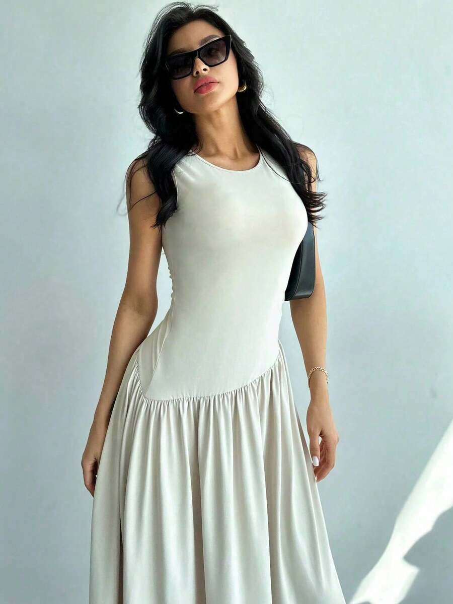 Vestido largo de mujer sin mangas, de color liso y cuello redondo, nuevo estilo veraniego, corte ajustado y favorecedora falda larga con diseño de retazos. - amarillo ganso - Ver 1
