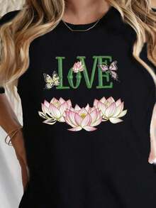 Camiseta de cuello redondo con estampado floral y de mariposas, corte regular premium, top casual de manga corta para primavera y verano, atuendo diario casual para mujer, ecológico. - Negro - Ver 1