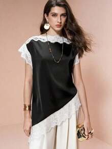 Blusa de mujer , de tela de piqué con lunares en blanco y negro, con empalme de encaje de unicolor y bajo asimétrico, elegante para citas y atuendos de verano - Blanco y Negro - Ver 7