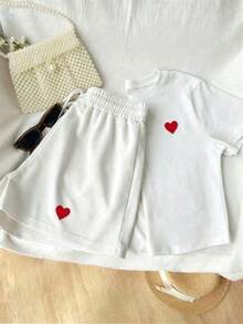 Almacén local, una camiseta de manga corta para mujer con estilo retro americano, de corte holgado y diseño estampado (los pantalones son solo para sugerencias de estilo). Esta pieza sencilla y elegante presenta un patrón de letras impresas con temática tropical, lo que la convierte en un elemento imprescindible para crear un look relajado de vacaciones, perfecto para ocasiones como el Día del Trabajo y el Día de la Independencia de México. - Blanco - Ver 1