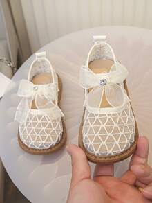 1 Pair Girls' Hollow Mesh Breathable Shoes, Decorated With Bows And Rhinestones, Soft Rubber Sole, Round Toe, Single Strap, Flat Heel, Sweet Princess Style Mary Jane Mesh Shoes, Suitable For Summer Daily Wear, School, Parties, Weddings, And Banquets - Beige - View 1