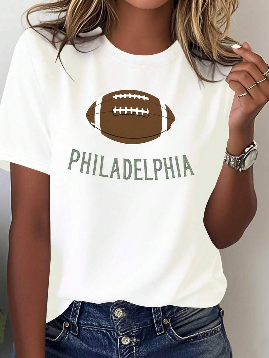 Limited Edition Women's T-Shirt With Philadelphia Football Design - Casual Fan Wear, Bold Team Spirit Design, Comfortable For All Seasons, Machine Washable - Black With Green Lettering And Brown Football Print, Lightweight Cotton. - White - View 1