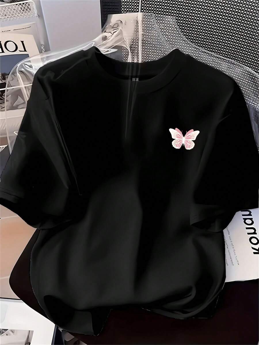 Camiseta de mujer con estampado de mariposas - Top de manga corta con cuello redondo suave, presenta un diseño en el pecho izquierdo, adecuada para todas las estaciones, estilo versátil, camiseta de corte holgado, ropa casual duradera, uso diario, tela cómoda, camiseta estampada, estilo urbano. - Negro - Ver 1