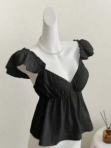 Top corto de camisola con escote bajo y espalda descubierta, con manga tipo gorra y volantes en azul, diseño sexy - Negro - Ver 1