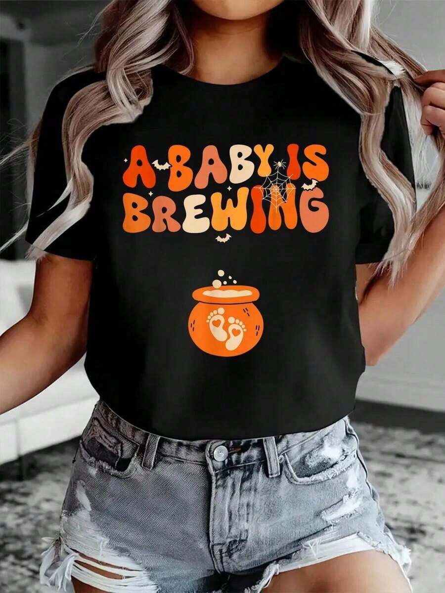 1 Pieza de Camiseta Casual de Moda para Hombres y Mujeres, 100% Algodón, con Estampado Divertido de Anuncio de Embarazo "Un Bebé Está en Camino" - Camiseta Casual de Cuello Redondo y Manga Corta, Cómoda para Primavera y Verano, Ropa de Mujer Versátil, fácil de combinar, adecuada para uso diario, estilo urbano, ropa de vacaciones, ropa de fin de semana. - Negro - Ver 1