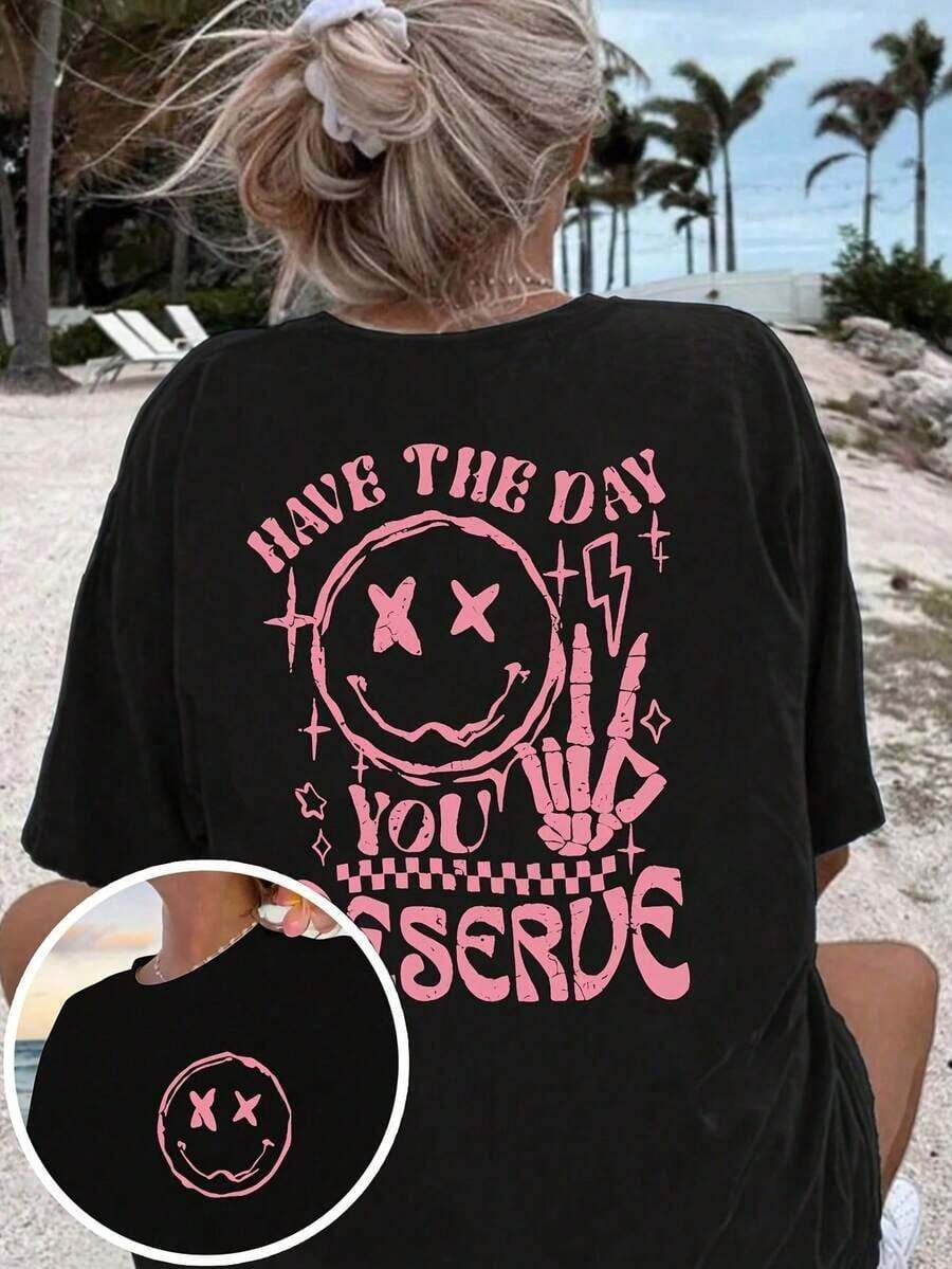 Camiseta gráfica de verano para mujer 'Ten el día que te mereces' - Transpirable, de manga corta y cuello redondo, con diseño de cara feliz y letras, ropa casual de moda para el verano. - Negro - Ver 1