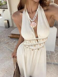 Vestido largo de línea A con cuello halter de escote profundo en V, cintura con lazo, dobladillo con volantes, adornos de conchas y flecos, textura plisada en color albaricoque.Vestido de mujer primavera/verano, para vacaciones, playa, estilo b - Albaricoque - Ver 3