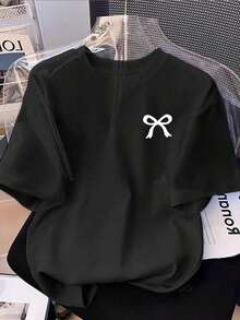 Camiseta de manga corta con cuello redondo y estampado de lazo para mujer, estilo casual y sencillo, 100% algodón. - Negro - Ver 1