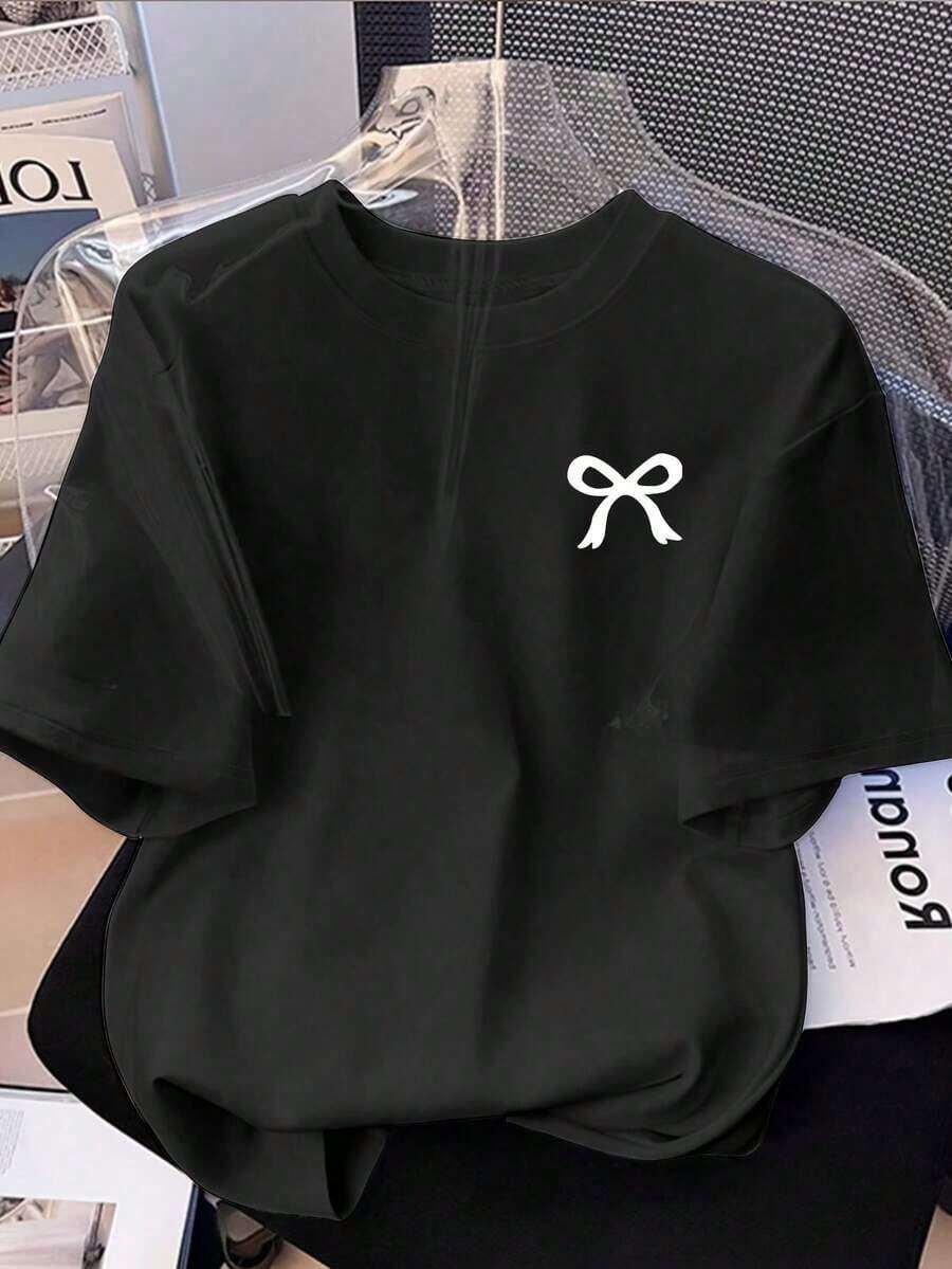 Camiseta de manga corta con cuello redondo y estampado de lazo para mujer, estilo casual y sencillo, 100% algodón. - Negro - Ver 1