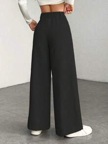 a Pantalones con bolsillo y cremallera de unicolor de poliéster, adecuados para uso diario en primavera, otoño e invierno, color negro - Negro - Ver 2