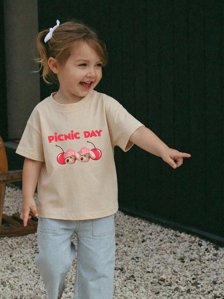 1 pieza Camiseta básica de manga corta con cuello redondo para bebé niña, con estampado de gráfico de dibujos animados, lema y letra, ropa informal y de moda para bebés - Albaricoque - Ver 1