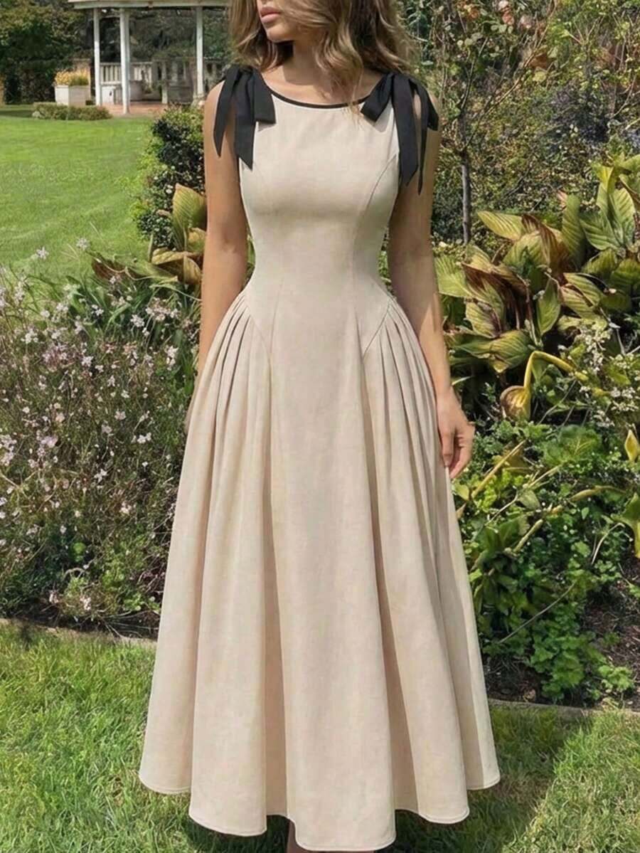 Vestido color albaricoque con cuello redondo, sin mangas, con ribete de contraste, lazo decorativo en la cintura y bajo acampanado - Caqui 2 - Ver 1