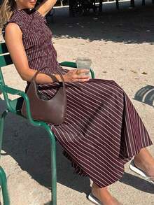 Moda primavera/verano 2026: Un vestido largo versátil adecuado para uso diario, ocasiones casuales, trayecto al trabajo y estilo callejero. Sensual, elegante y con aire de dama madura con diseño de volantes en el bajo, creando una atmósfera de resort de playa. - Verde Oliva - Ver 10