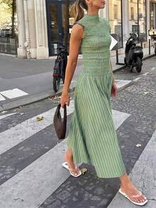 Moda primavera/verano 2026: Un vestido largo versátil adecuado para uso diario, ocasiones casuales, trayecto al trabajo y estilo callejero. Sensual, elegante y con aire de dama madura con diseño de volantes en el bajo, creando una atmósfera de resort de playa. - Verde Oliva - Ver 4