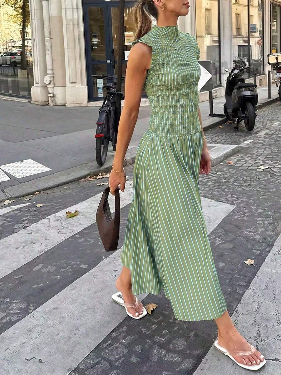 Moda primavera/verano 2026: Un vestido largo versátil adecuado para uso diario, ocasiones casuales, trayecto al trabajo y estilo callejero. Sensual, elegante y con aire de dama madura con diseño de volantes en el bajo, creando una atmósfera de resort de playa. - Verde Oliva - Ver 1
