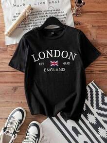 Camiseta básica de manga corta para mujer Otoño/Invierno 2025: cuello redondo, corte holgado, estampado de Londres de moda, tejido suave con caída perfecta y ultra combinable blusas para mujer playeras de mujer blusas casuales para dama - Negro - Ver 1