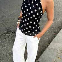2026 Nueva llegada Blusa sin mangas de cuello halter para mujer - Lindo estampado de lunares negros con espalda abierta y detalle de lazo autoanudado, bajo acampanado, cintura ajustada, tela liviana y fluida tipo gasa, vibra retro, uso casual de verano, para citas, vacaciones en la playa, fiestas de fin de semana, estética de moda, elegante, uso diario y salidas - 1 - Ver 6