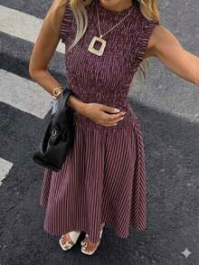 Moda primavera/verano 2026: Un vestido largo versátil adecuado para uso diario, ocasiones casuales, trayecto al trabajo y estilo callejero. Sensual, elegante y con aire de dama madura con diseño de volantes en el bajo, creando una atmósfera de resort de playa. - Verde Oliva - Ver 11