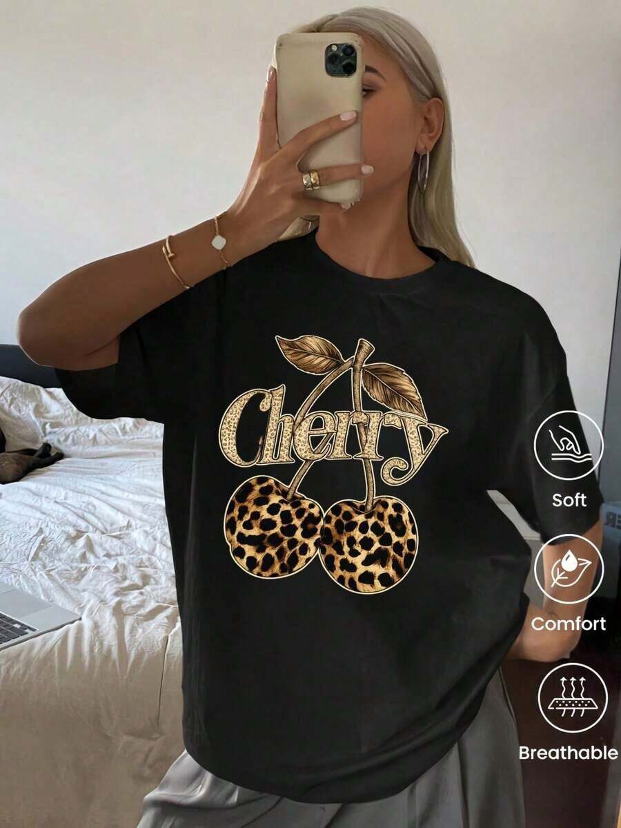 Camiseta de cuello redondo y mangas cortas de ropa fashion, fabricada en México, para la temporada primavera-verano 2025. Con estampado de dibujos animados, es un modelo de pareja, apta para usar tanto por dentro como por fuera, ideal para oficina y estilo casual, diseñada para hombres y mujeres, en unidad individual. - Negro - Ver 1