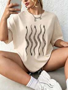 Camiseta de manga corta para mujer con estampado de serpientes, cuello redondo, tejido de poliéster, ideal para uso diario, salidas casuales y reuniones con amigos, estilo casual, temporada primavera-verano, Envío nacional a México. - Albaricoque - Ver 1