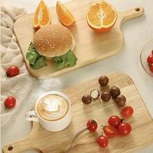 Dụng cụ nhà bếp bằng gỗ gồm: xẻng nướng pizza, thớt, dao cắt phô mai, khay đựng bánh mì/bánh quy nhỏ, đĩa chuẩn bị bít tết, thớt thái rau củ. - Màu be - Xem 2