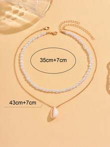 Bộ 2 chiếc vòng cổ mặt dây chuyền vỏ sò trắng lãng mạn cho kỳ nghỉ hè, vòng cổ choker đính hạt ngọc trai giả bất đối xứng thời trang, thích hợp cho nam, nữ, các cặp đôi, đeo hàng ngày, đi biển, dự tiệc. - Nhiều màu - Xem 4