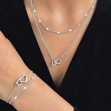 Bộ trang sức 2 món bằng thép không gỉ, gồm dây chuyền và vòng tay hình trái tim, thích hợp để đeo hàng ngày, làm quà tặng cho học sinh và bạn thân. - Kiểu trái tim đôi - Xem 3