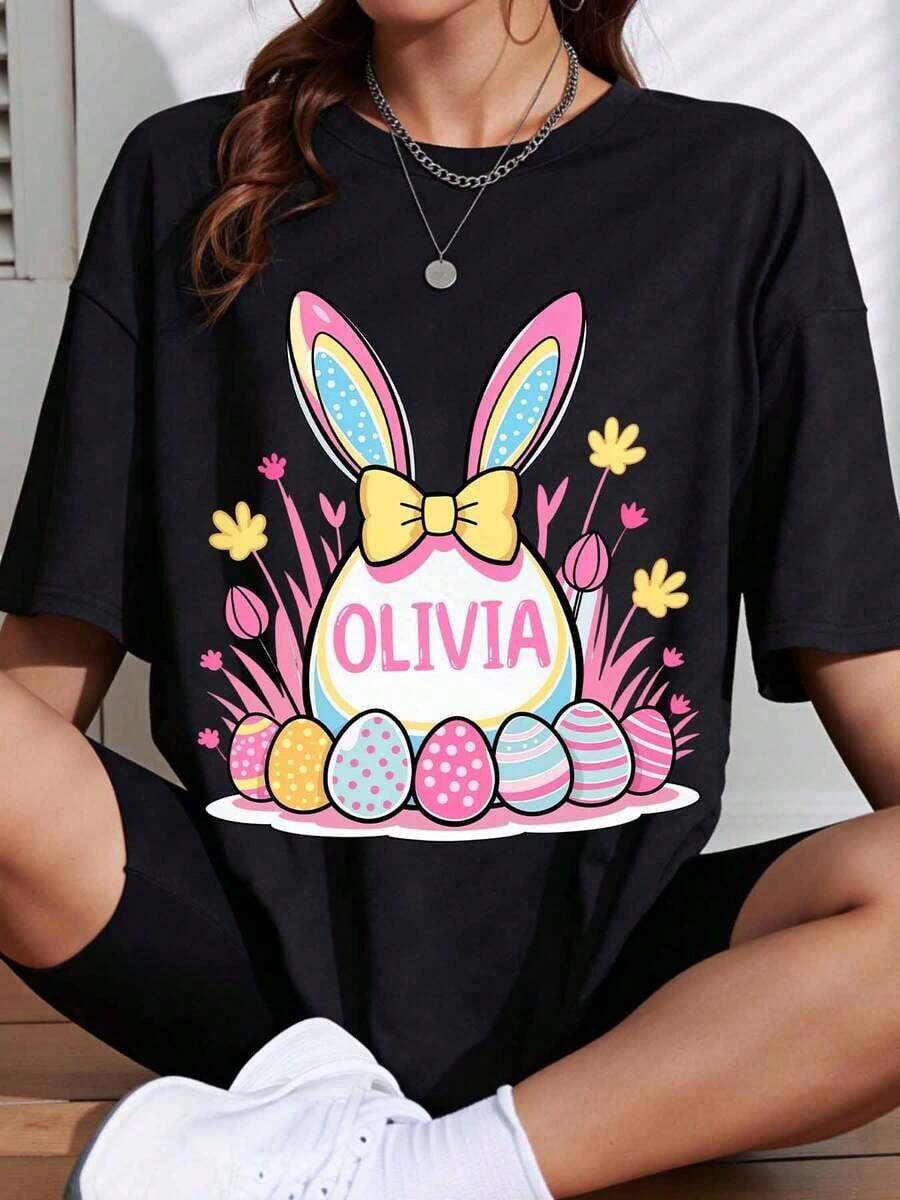 1 White Easter Bunny T-Shirt With Personalized Name Olivia, With Colorful Eggs And Flowers, Spring Holiday Clothes, 180g, 100% Cotton. - 黑色 - 查看 1