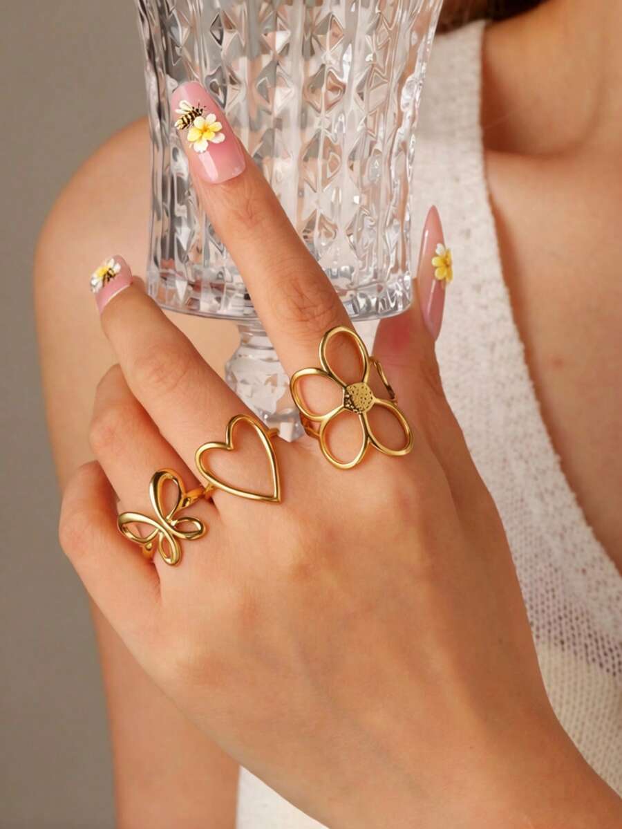 GEREIT Bộ 3 chiếc nhẫn bằng thép không gỉ mạ vàng 18K, kiểu dáng thời trang mùa xuân/hè dễ thương, họa tiết trái tim rỗng và hoa, phù hợp cho nữ giới đeo hàng ngày. - Nhiều màu - Xem 1