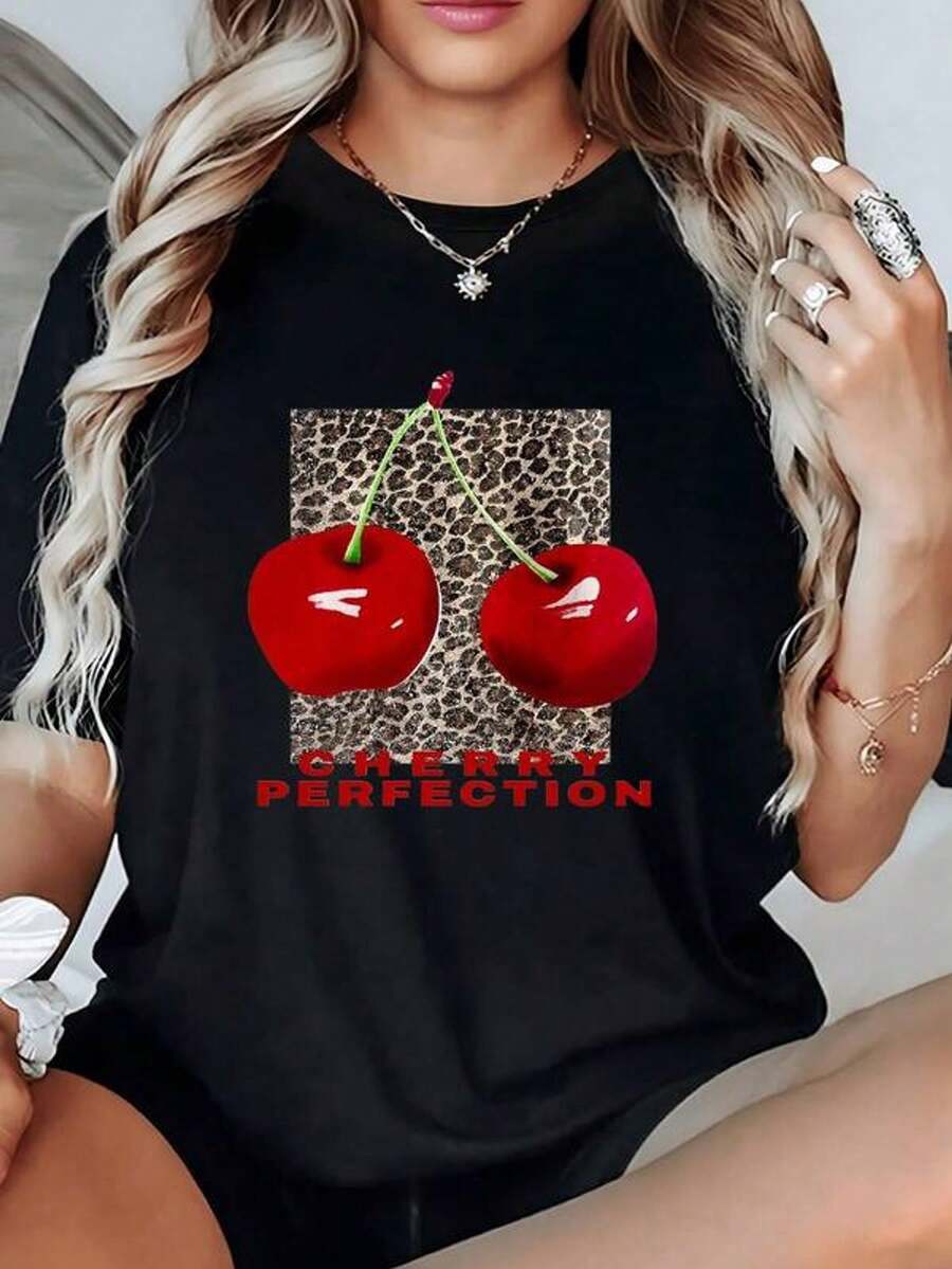 Two Bright Red Cherries On An Animal Print Background Symbolize Sweetness, Passion, And Energy In Natural Contrast. Comfortable 100% Cotton Women's T-Shirt, Perfect For Everyday Wear. - 黑色 - 查看 1