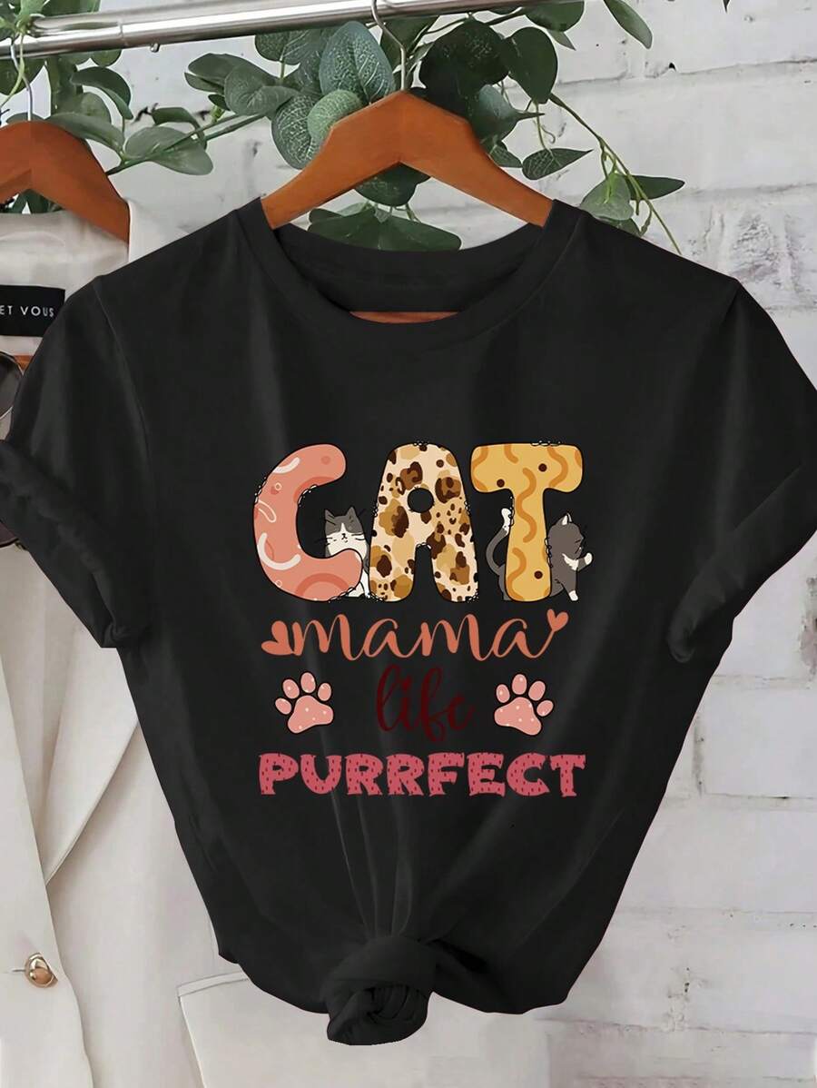 Camiseta gráfica 'Mama' para mujer - casual, manga corta, cuello redondo, ligera y transpirable para primavera y verano, lavable enáquina, camiseta de uso diario | Diseño juguetón de gato | Ajuste cómodo, regalos para amantes de los gatos - Negro - Ver 1