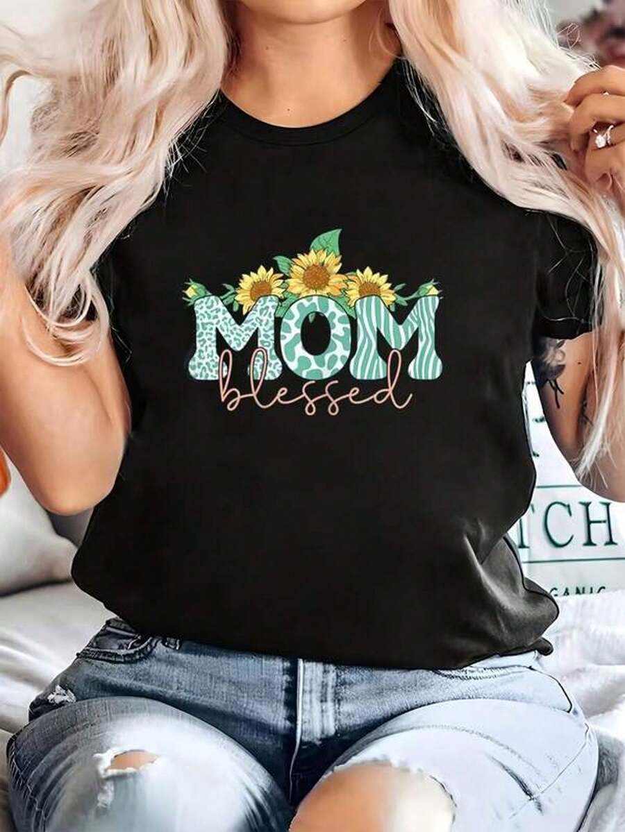 [S-7XL] Nueva Camiseta de Algodón para Mujer con Estampado de Girasoles, Ideal para Mamás - Camiseta de Corte Holgado, Manga Corta, Cuello Redondo, Estilo Blusa, con Letras Florales en Negro/Verde/Amarillo y Diseño de Hojas de Girasol, Camiseta Casual Lavable a Máquina para Regalo del Día de la Madre, Uso Diario para la Familia. El Mejor Regalo para Mamá en el Día de la Madre. - Negro - Ver 1