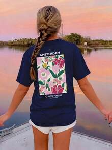 Camiseta de manga corta beige con cuello redondo, estampado floral y de letras, estilo casual, holgada y versátil para mujer, ideal para el verano y el uso diario, color blanco. - Marina de - Ver 1