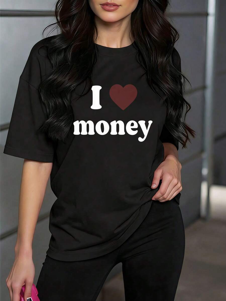 Camiseta de manga corta para mujer, con estampado de letras divertidas "I ❤️ money", combinación de corazón y letras gruesas, cuello redondo, ideal para uso diario casual. - Negro - Ver 1