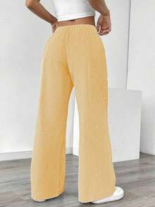 Pantalones sueltos para mujer con rayas azules de tiro bajo para vacaciones y uso informal - Amarillo - Ver 2