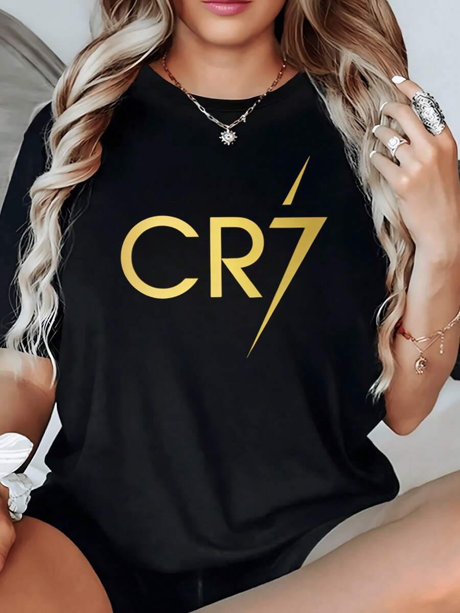 Gold Symbol With Large Letters Expressing Strength, Confidence, And Energy, Conveying A Modern Sense Of Empowerment And Active Attitude. Comfortable And Stylish Casual Women's T-Shirt - 黑色 - 查看 1