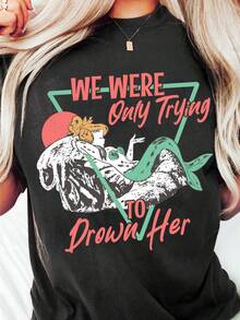 This Loose-Fitting T-Shirt Perfectly Blends Fun And Comfort. The Eye-Catching Red And Green Letter Print Complements The Dreamy Island Mermaid Theme, Adding A Touch Of Joy And Unique Charm To Your Wardrobe. Designed For Comfort And Practicality, It's Perfect For Everyday Wear And Makes A Great Gift. This Circus-Themed T-Shirt Is Ideal For Holidays And Playtime, And Great For Parties And Family Vacations. It's Also A Summer Outfit Perfect For Warm Weather. - 黑色 - 查看 7