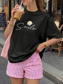 Camiseta informal de manga corta con cuello redondo y estampado de margaritas para mujer, de poliéster, de largo normal, ideal para conjuntos primaverales. - Negro - Ver 2