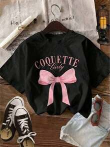 Fashion Printed T‑Shirts for Women, Oversized Streetwear Tops, Comfortable and Stylish All‑Match Summer TeesCamiseta femenina coquette casual lazo estampado tejido suave holgada cuello redondo manga corta primavera verano uso diario T-shirt - Negro - Ver 1