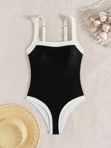 Traje de baño de una pieza elegante y ajustado con corte de color en contraste azul marino y blanco, con tirantes anchos ajustables para mujer, Primavera/Verano 2026 - Blanco y Negro - Ver 2