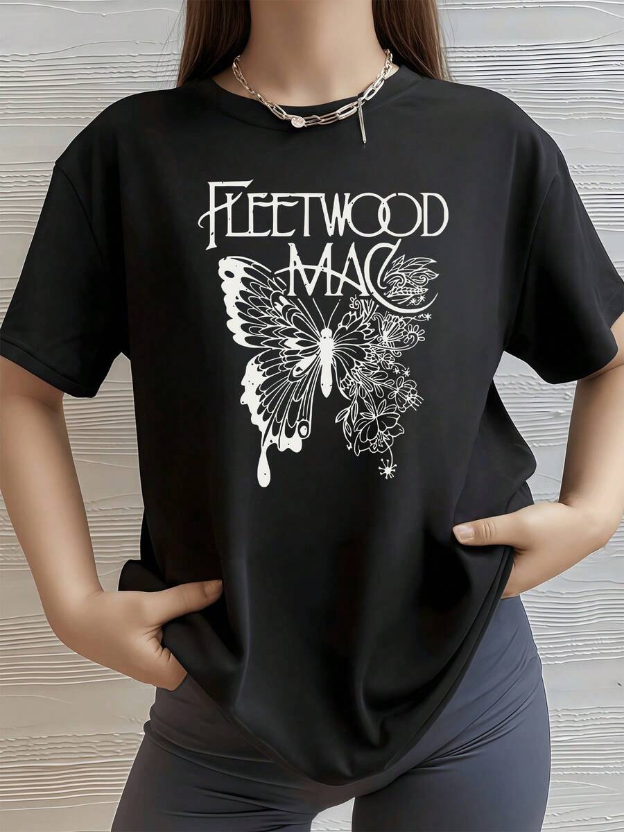 Mariposa con alas extendidas que simboliza la libertad espiritual y la conexión con la naturaleza acompañada por flores que expresan crecimiento y renovación camiseta de mujer para uso casual elegante y cómodo - Negro - Ver 1