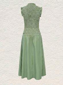 Moda primavera/verano 2026: Un vestido largo versátil adecuado para uso diario, ocasiones casuales, trayecto al trabajo y estilo callejero. Sensual, elegante y con aire de dama madura con diseño de volantes en el bajo, creando una atmósfera de resort de playa. - Verde Oliva - Ver 9
