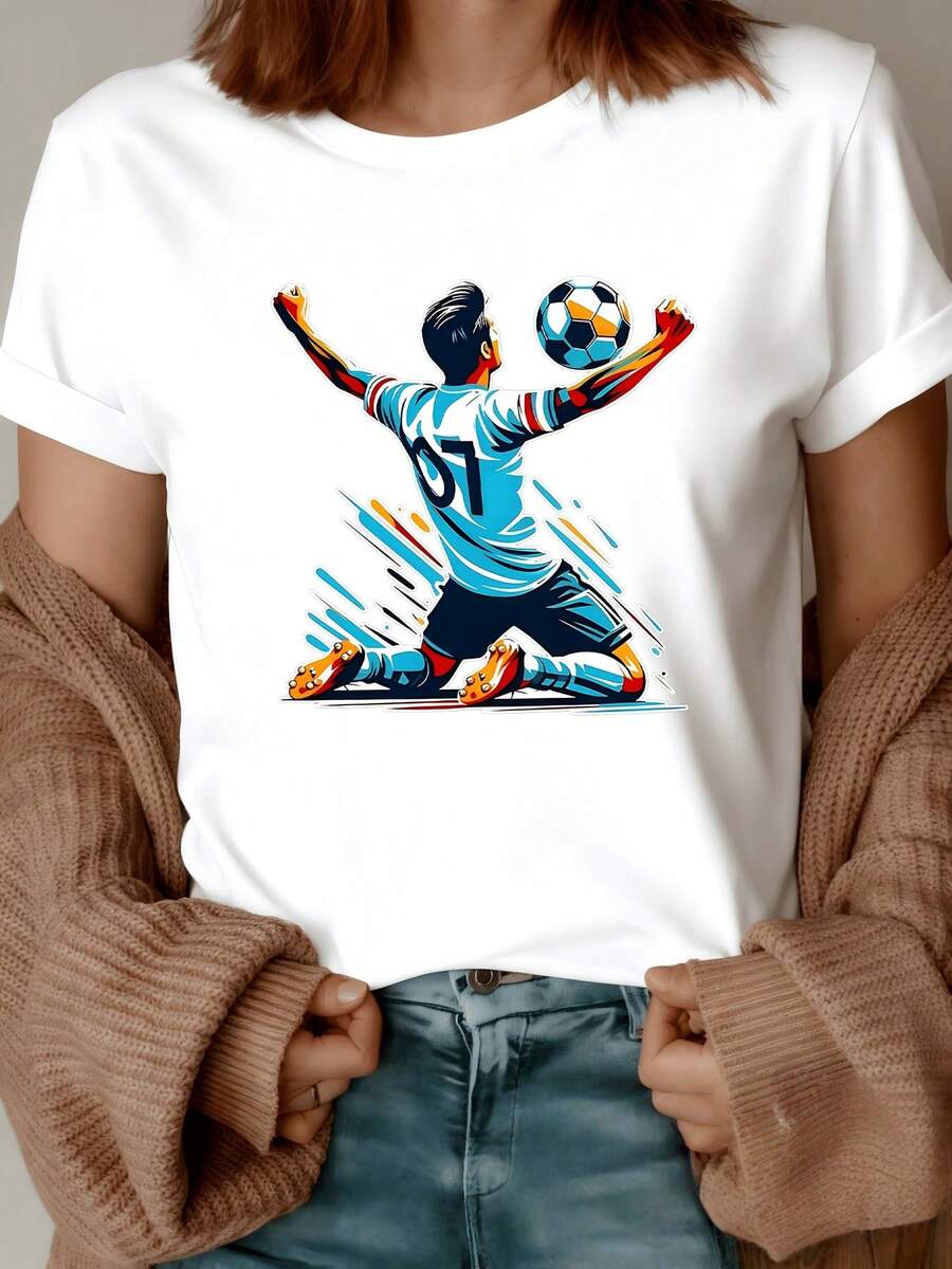 Player Celebrating The Moment Of Triumph With Passion And Energy, Holding The Ball While Kneeling, Evoking Strength, Determination, And Joy. Comfortable, Modern Women's T-Shirt For Football Fans. - 白色 - 查看 1