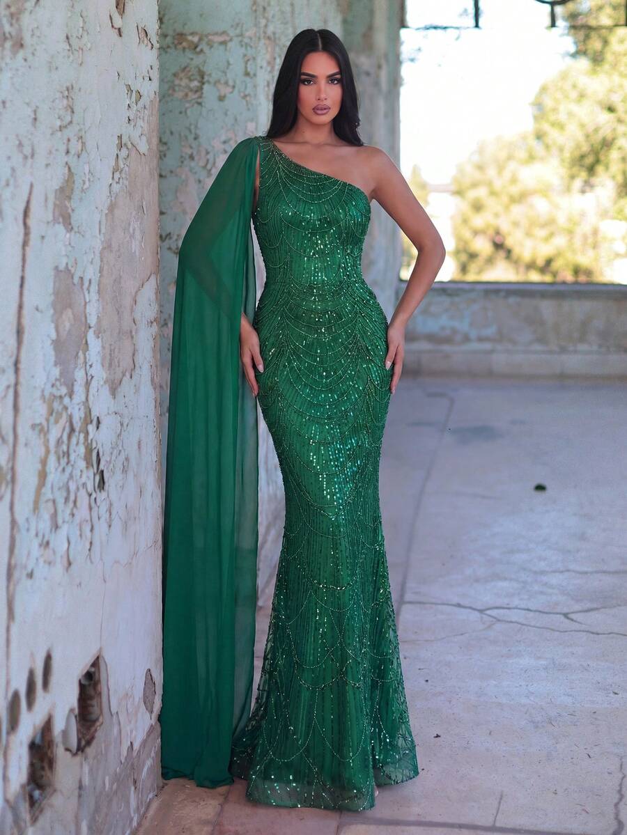 Faeriesty Đầm dài đuôi cá đính sequin thanh lịch và quyến rũ dành cho nữ, với cổ áo bất đối xứng và tay áo kiểu cape, phù hợp cho các buổi dạ tiệc, lễ kỷ niệm, đám cưới, sự kiện và các bữa tiệc. - Màu xanh lá cây đậm - Xem 1