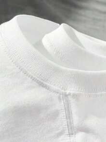 Camiseta de manga corta 100 % de ajuste holgado para mujer con estampado de un lindo caniche soplando un abanico - Prenda superior transpirable de cuello redondo, cuello acanalado - Ropa casual adecuada para usar en capas y atuendos diarios100% Cotton - Blanco - Ver 4