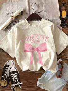 Envío gratis, entrega local enéxico, entrega en 4 días. Camiseta de mujer estilo coqueta, casual, estampada, con lazo, de tela suave, cuello redondo, manga corta, para uso diario en primavera y verano. - color hueso - Ver 5