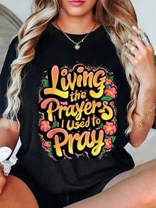 Women's Plus Size Religious Faith T-Shirt - "Living The Prayers I Used To Pray" Round Neck And Short Hands With Vibrant Multicolor Lettering & Floral Detail, Casual Christian Inspirational Clothing Ideal For Devotional Gatherings Or Spiritual Events - 黑色 - 查看 1