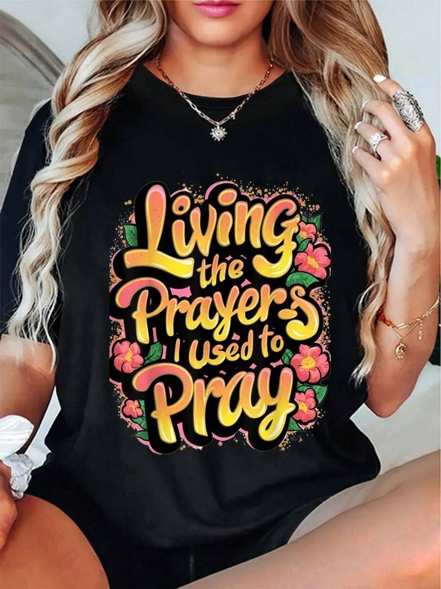 Women's Plus Size Religious Faith T-Shirt - "Living The Prayers I Used To Pray" Round Neck And Short Hands With Vibrant Multicolor Lettering & Floral Detail, Casual Christian Inspirational Clothing Ideal For Devotional Gatherings Or Spiritual Events - 黑色 - 查看 1