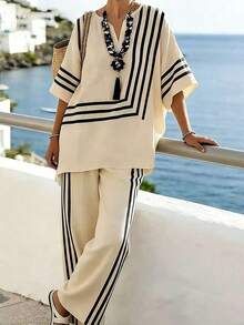 2026 Nuevo estilo casual de vacaciones de primavera/verano, conjunto de lino a rayas en beige y negro + blusa con estampado geométrico de manga murciélago + pantalones anchos con rayas laterales. Estilo relajado de vacaciones en la playa, conjunto a rayas en beige y negro, transpirable y suave para el verano, pantalones de cintura elástica, conjunto casual de 2 piezas para vacaciones, conjunto versátil de 2 piezas para ir al trabajo. - Blanco y Negro - Ver 4